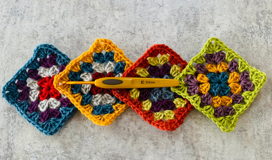 Colourful crochet granny square and Clover Soft Touch crochet hook