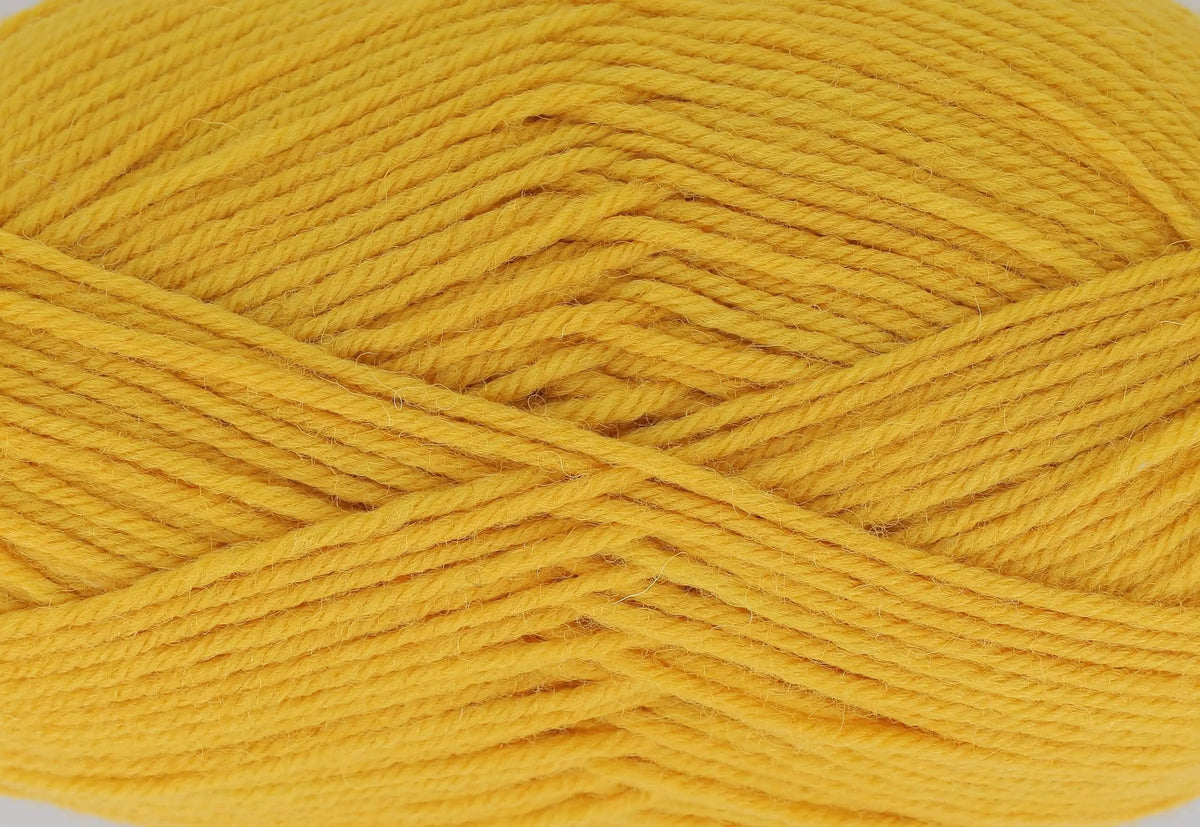 A close up of a warm yellow yarn. It is the shade Autumnal in King Cole Wildwood Chunky.