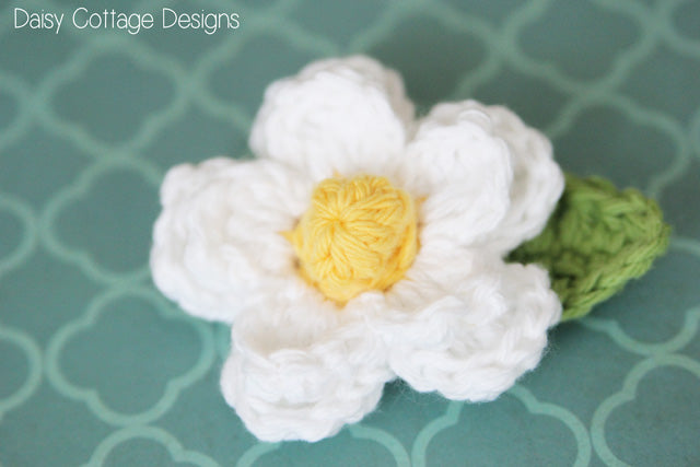 Crochet flower by Daisy Cottage Designs . White cotton DK 