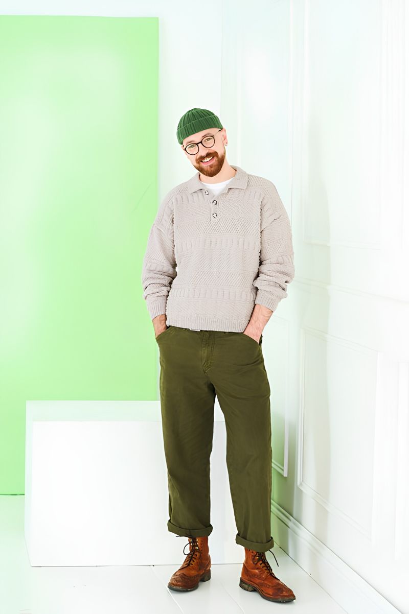 Man wearing a Stylecraft pattern knitted sweater with placket.