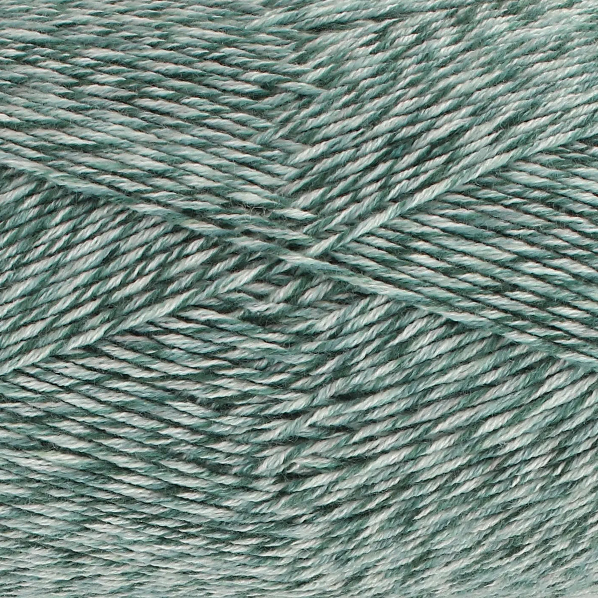 Close-up of King Cole Jamboree dk  yarn in Glamping Green, with shades of green and white.