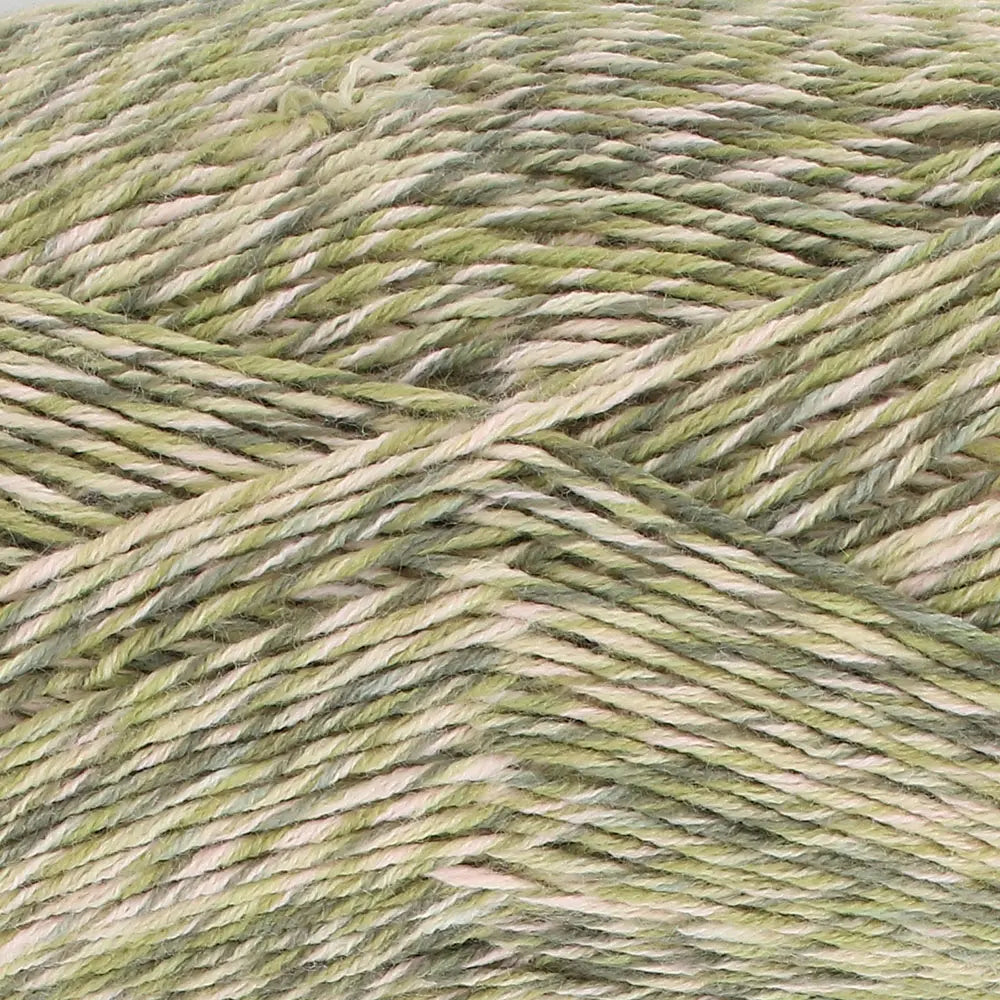 Close-up of King Cole Jamboree dk yarn in shade Mint Mojito with green and white tones.