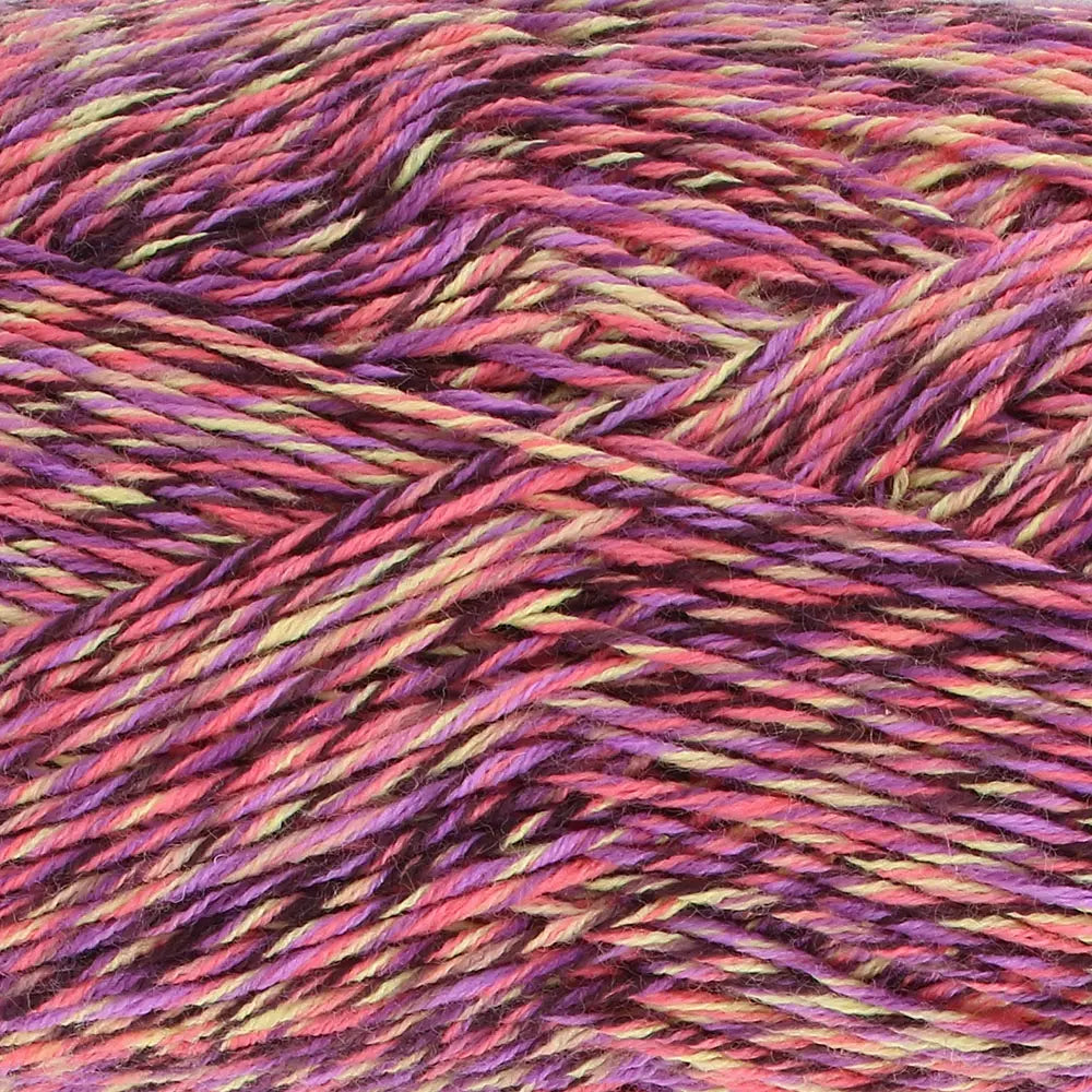 Close-up of King Cole Jamboree dk  yarn in Tropical Tango, with shades of orange, yellow, and purple.