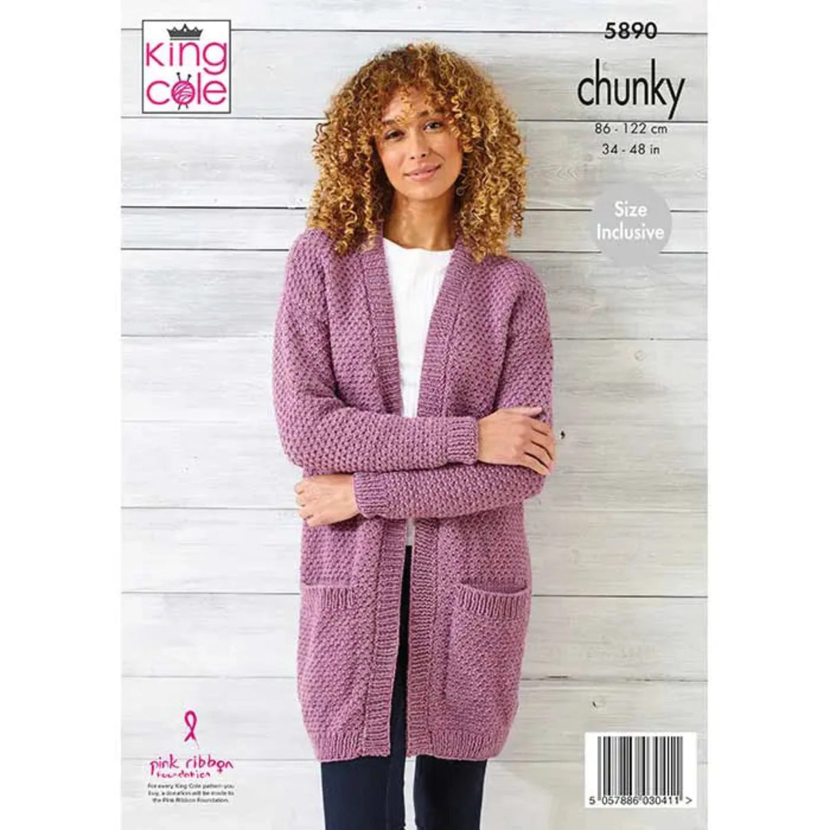 King Cole knitting pattern 5890, featuring a woman in a long purple cardigan with pockets, stood against a wood background. 
