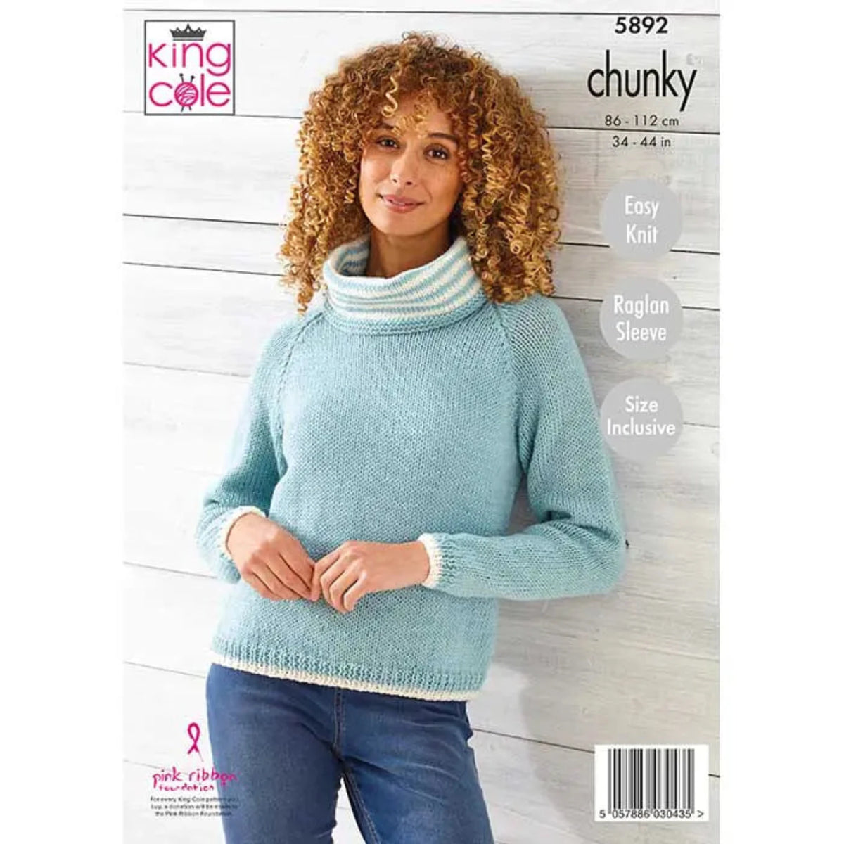 King Cole knitting pattern cover for chunky raglan sleeve sweater, size 34-44 in. The cover features a wearing a light blue chunky knit turtleneck sweater and blue jeans, standing against a white wood-paneled wall. The pattern is 5892 and is easy knit.