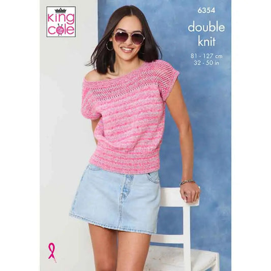 A woman wearing a pink off-the-shoulder double knit sweater and a light blue denim mini skirt, standing next to a white chair against a blue textured background. The King Cole brand logo is visible in the top left, with pattern number 6354 and size information in the top right.