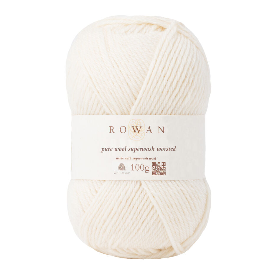 A ball of Rowan Pure Wool Superwash Worsted weight yarn, in shade Soft Cream 102, against a white background.