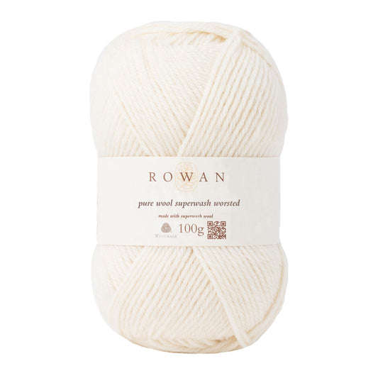 A ball of Rowan Pure Wool Superwash Worsted weight yarn, in shade Soft Cream 102, against a white background.