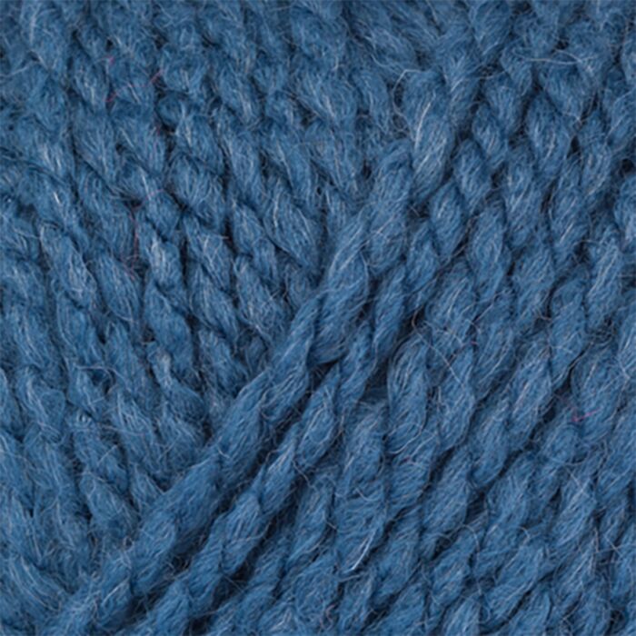 A close up photo of Stylecraft Softie chunky yarn in shade Indigo 2132.