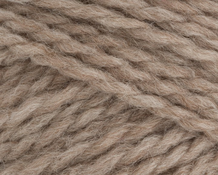 A close up photo of Stylecraft Softie chunky yarn in shade Oats 3983.