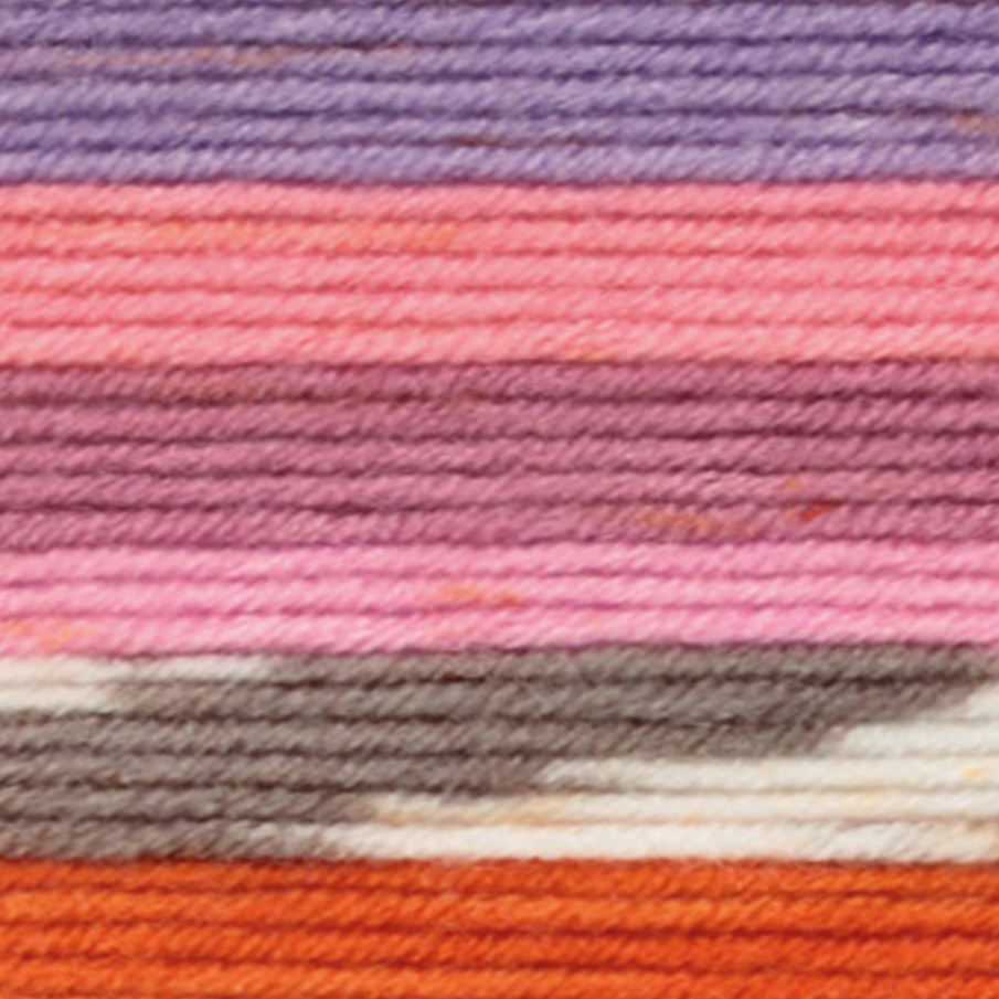 Variegated yarn containing purples, pinks, grey and white, and orange