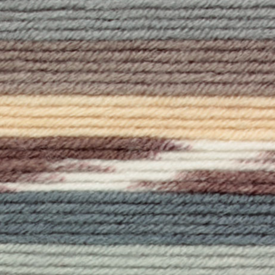 Variegated yarn containing grey, brown, cream and white