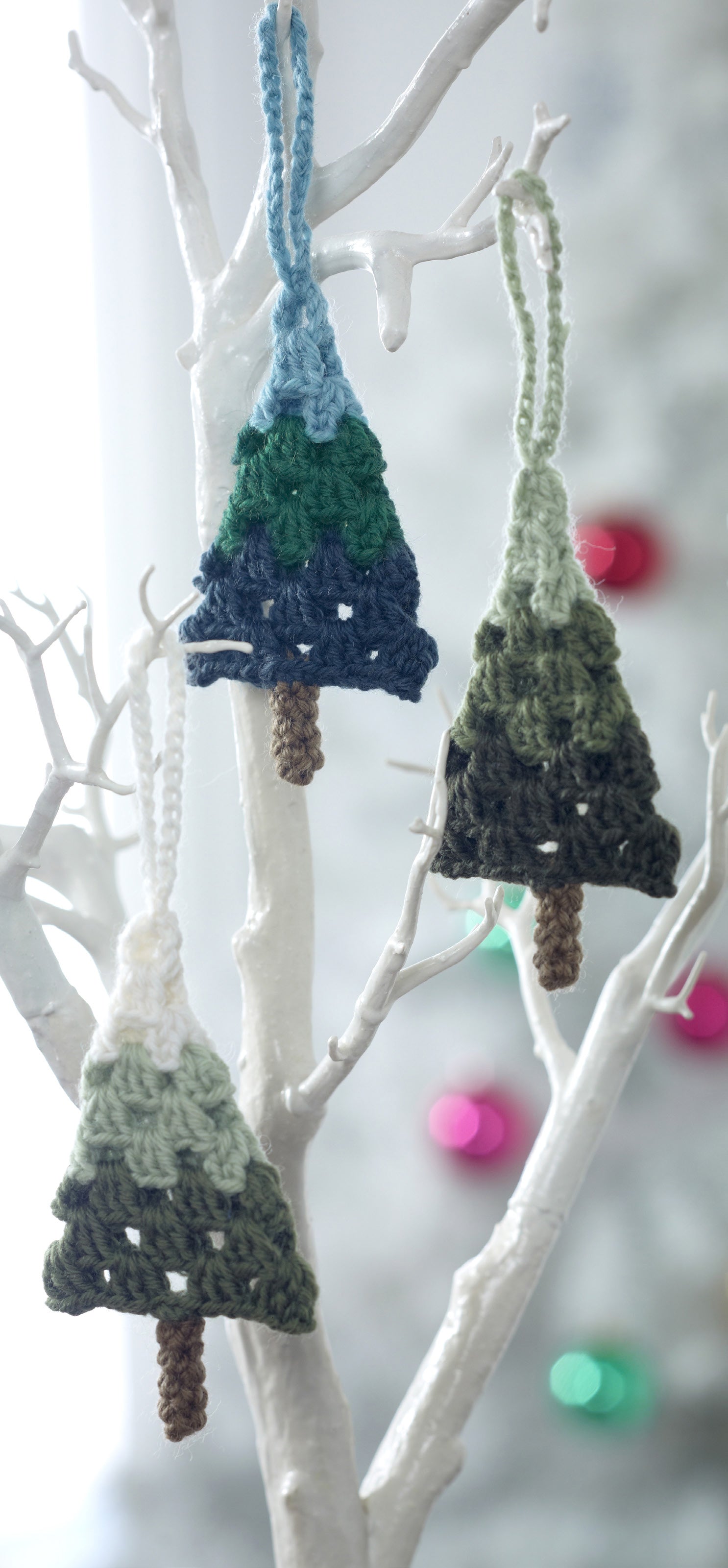 Decorative hanging trees in granny stitch. The tree colours gradients from green to white, dark green to light green and dark blue to light blue. Each is approximately 12cm high plus a hanging loop.